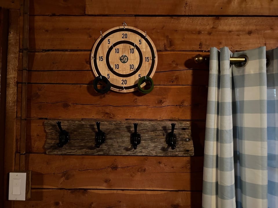 Ring toss and coat hooks in Main Cabin great room