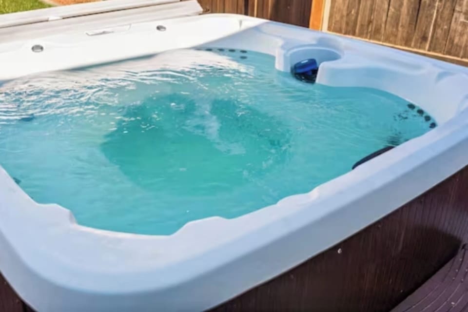 Nestled in a lush and green backyard, this home comes complete with its own hot tub. Imagine soaking away your troubles in the warm, bubbly water while gazing at the stars overhead.