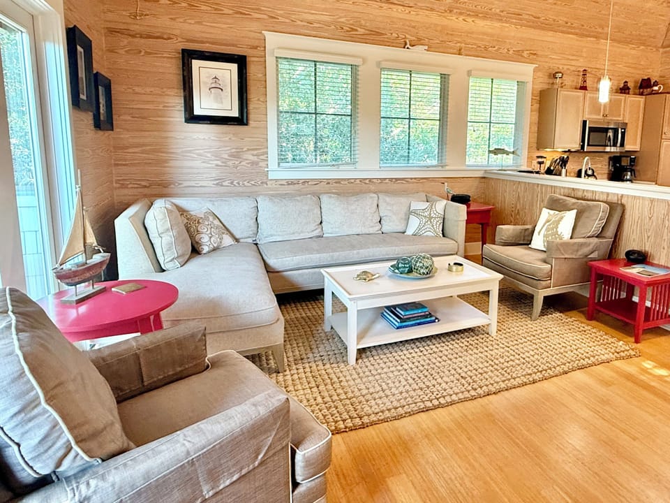 Comfy living area w/ access to open aired porch 