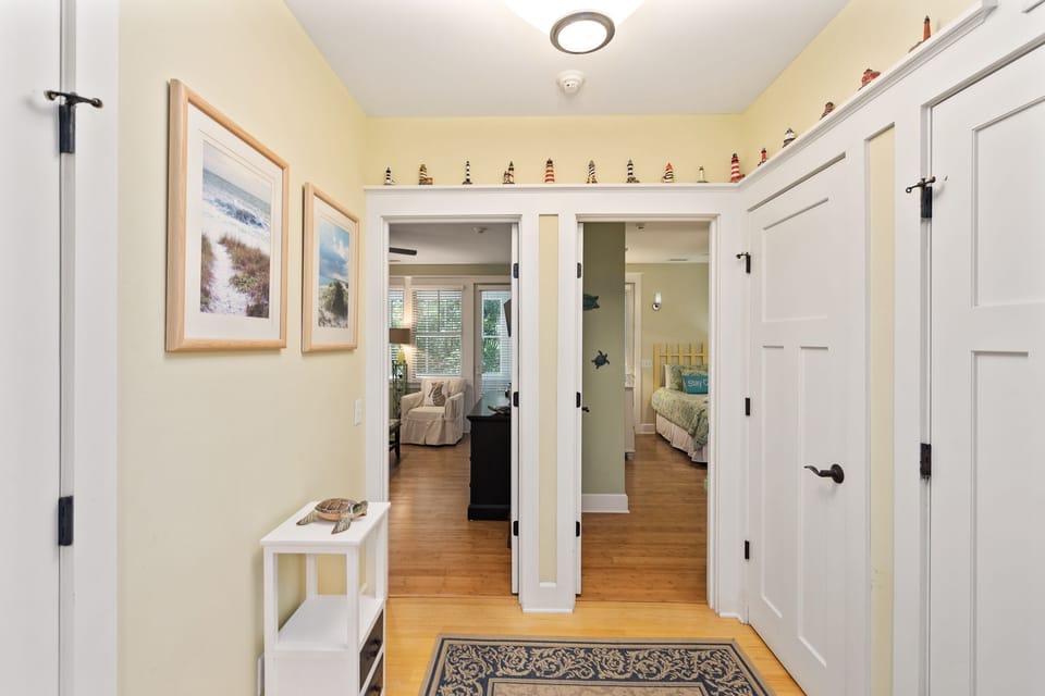 Downstairs hallway leading to bedrooms. Laundry area and closet.