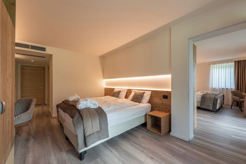 Deluxe Quadruple Room, 2 Bedrooms | In-room safe, desk, soundproofing, free WiFi