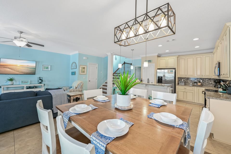 Gather around your spacious dining table where coastal charm meets modern comfort, perfect for memorable meals together.