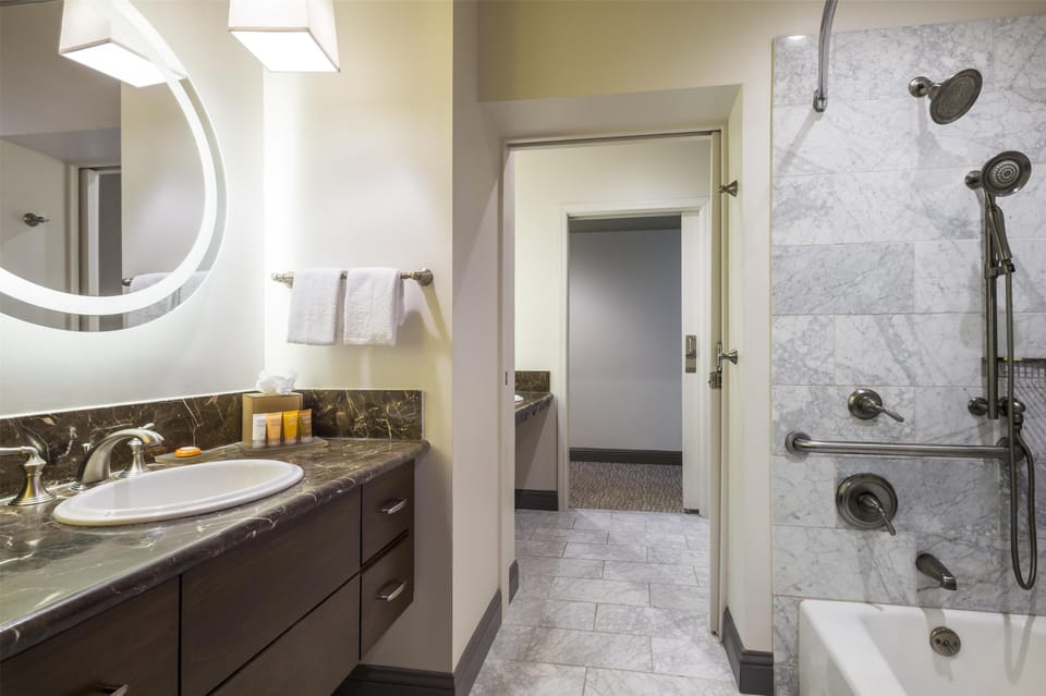 Combined shower/tub, designer toiletries, hair dryer, bathrobes