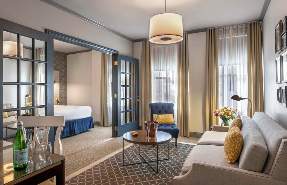 Grand Suite | Living area | 42-inch LCD TV with cable channels, TV, Netflix