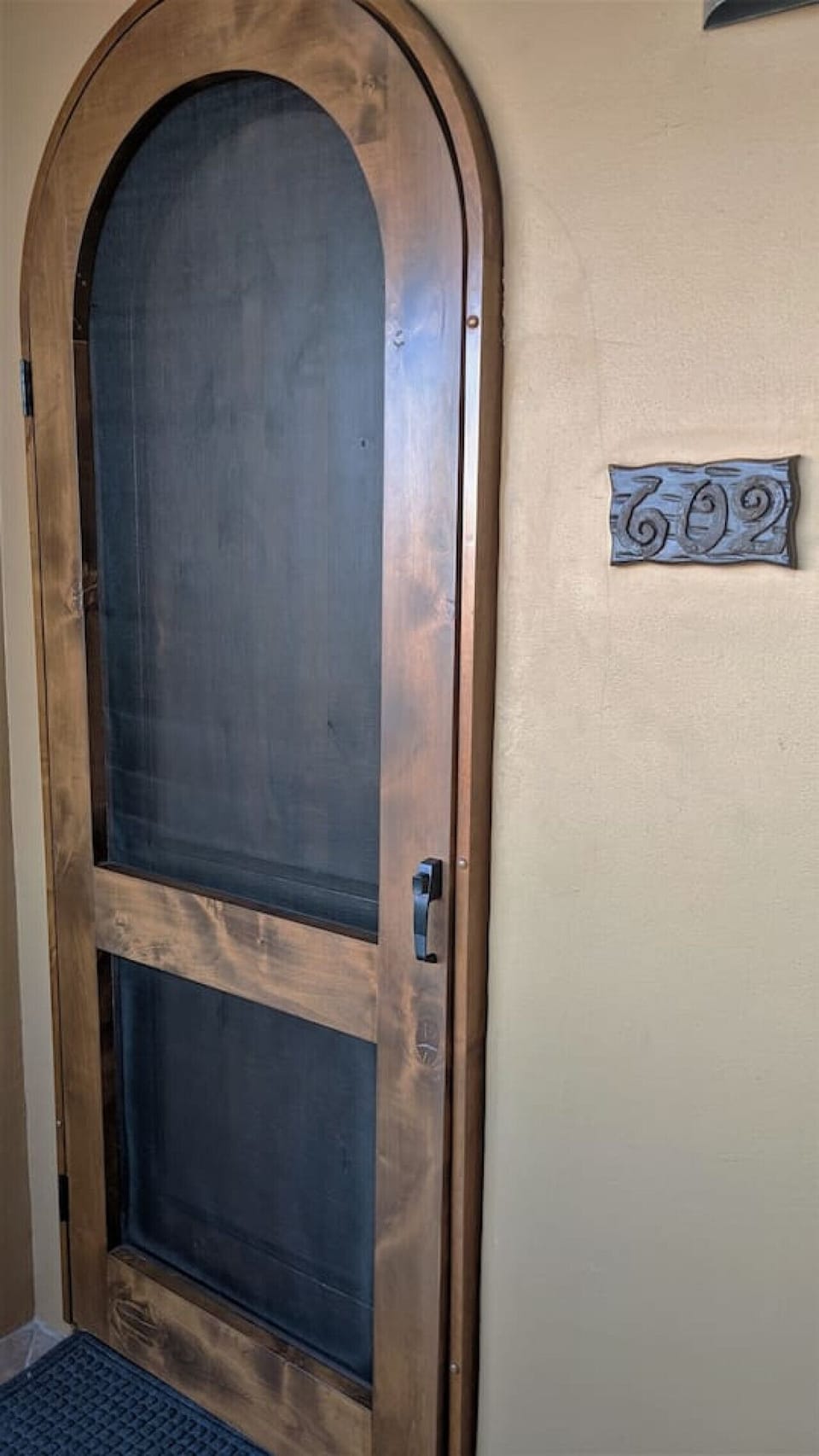 Bella Sirena 602-B entrance with screen door so you can let the air flow through the condo.