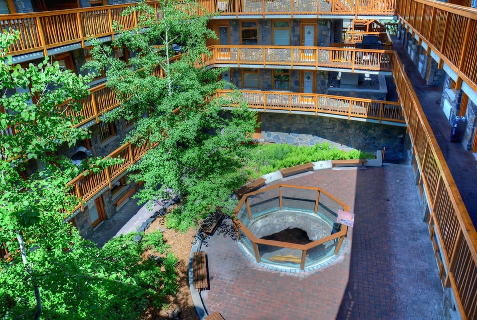 Imagine descending from your serene mountain room into a cave-inspired grotto to soak in hot pools.