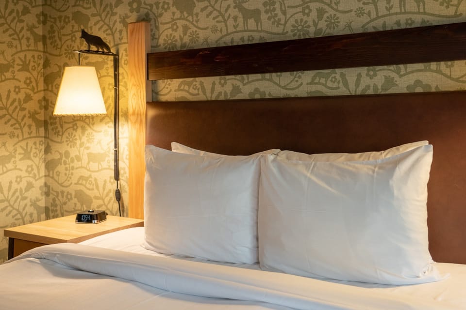 Drift to sleep in the Mountain Luxury queen-sized bed after a day exploring the Rockies.