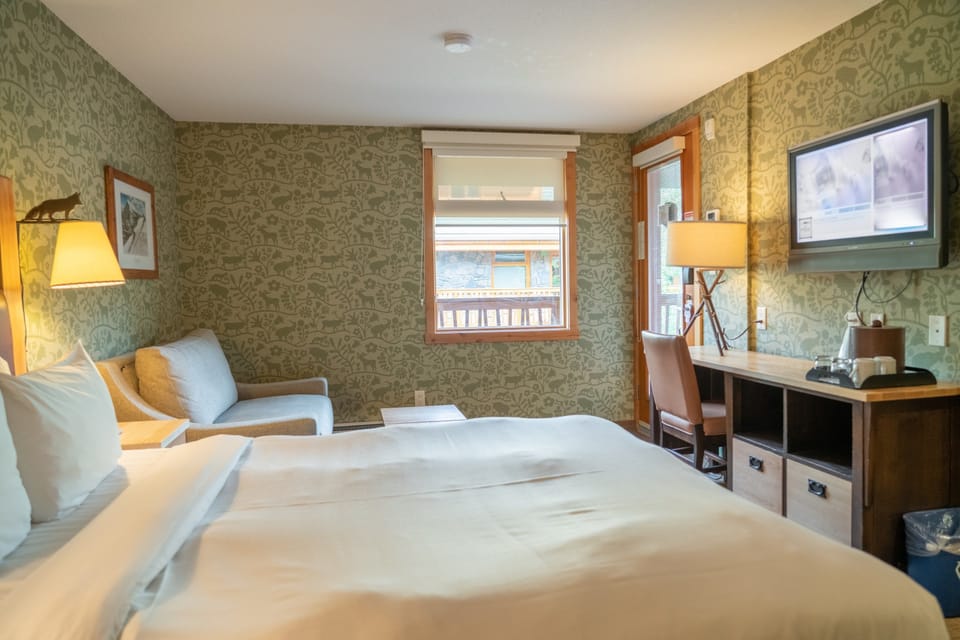 Take in views of the courtyard from this rustic and warmly decorated room.