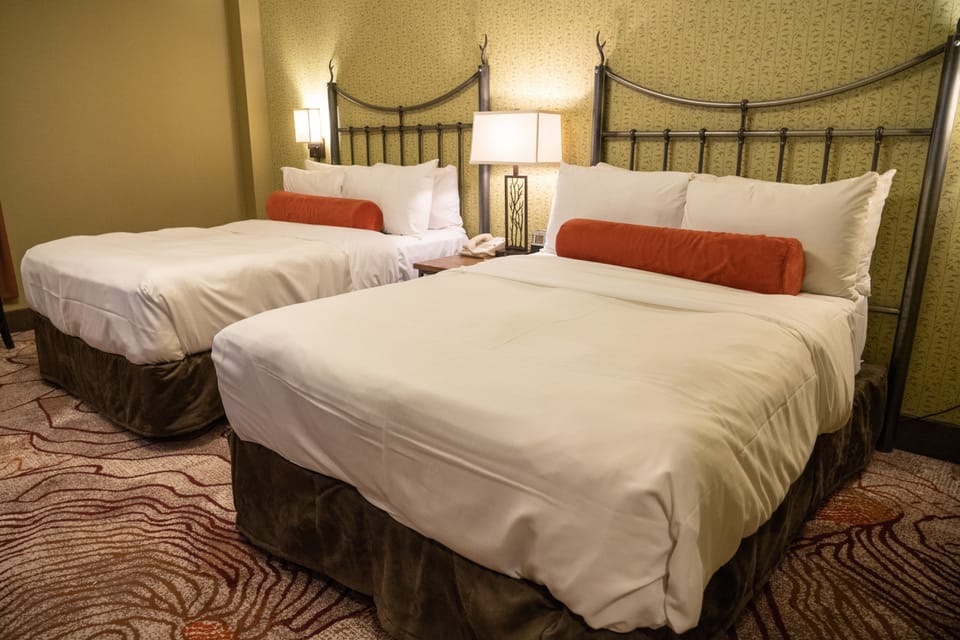 Spacious room with 2 Queen beds and luxury bedding.