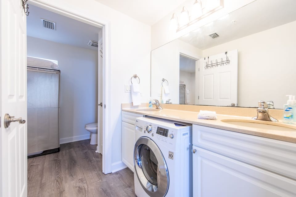 Bathroom, also pictured washer/dryer combo.