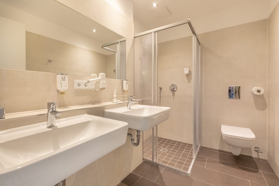 Shower, free toiletries, hair dryer, towels