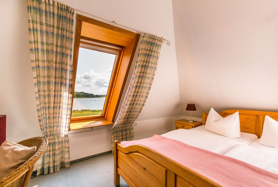 Triple Room, Lake View | Desk, blackout drapes, free WiFi, bed sheets