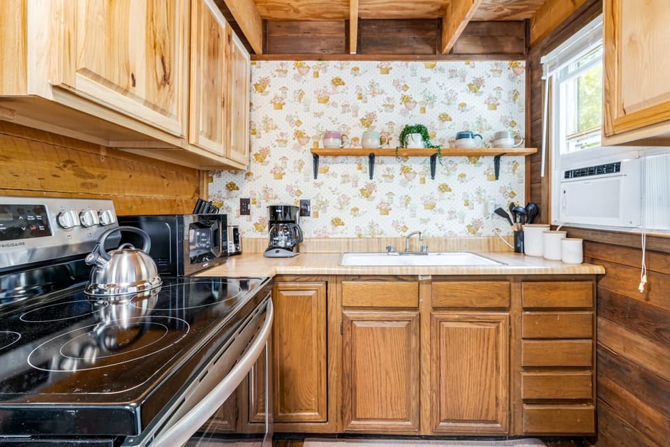 Fully-stocked kitchen with a stove/oven and microwave