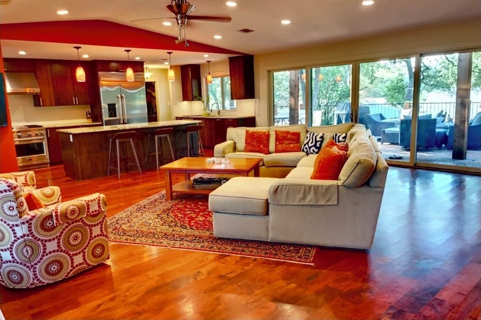 The living room has lots of natural light and couches to sit. 