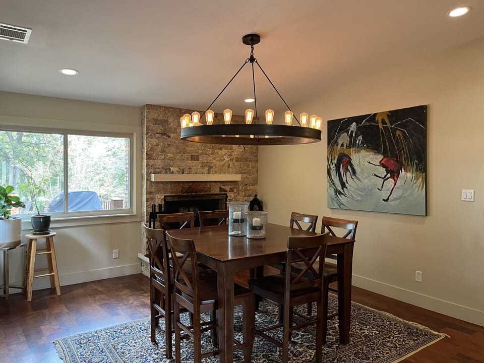 Dining room seats 8 guests and has a cozy fireplace