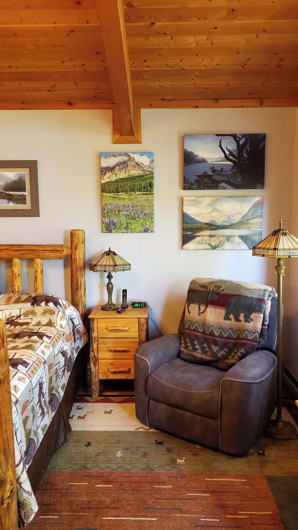 Upper level primary bedroom suite boasts an extra comfy recliner!