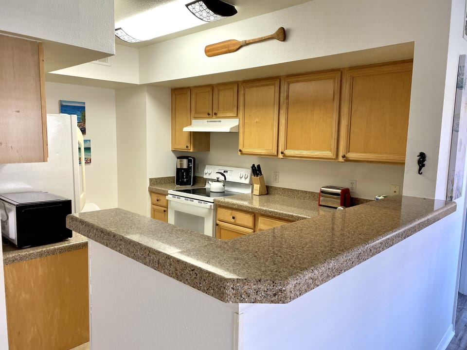 Stunning engineered stone counters; new GE glass top stove/oven; new microwave 