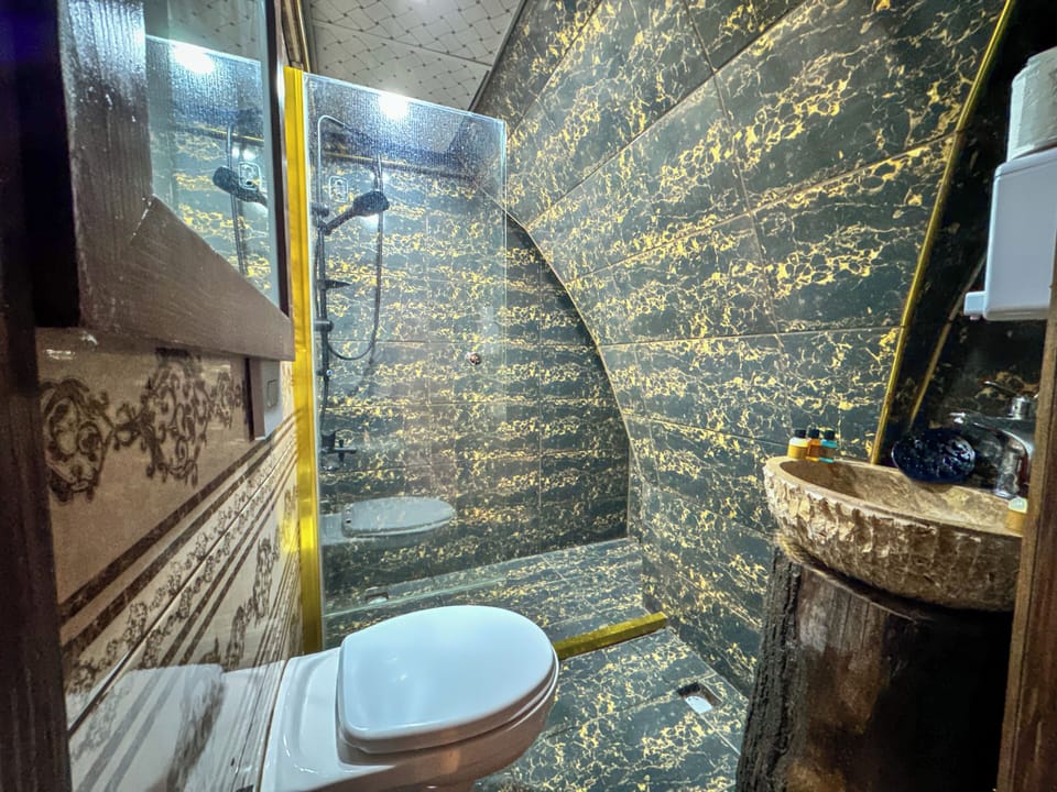 Triple Room | Bathroom | Shower, rainfall showerhead, hair dryer, bathrobes
