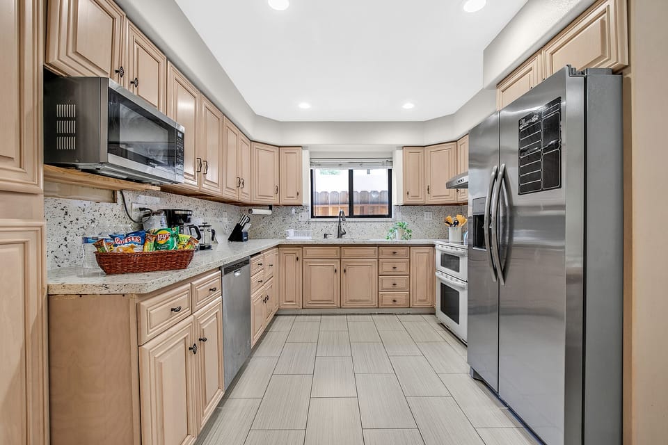 Updated and fully stocked Kitchen for all of your culinary needs.