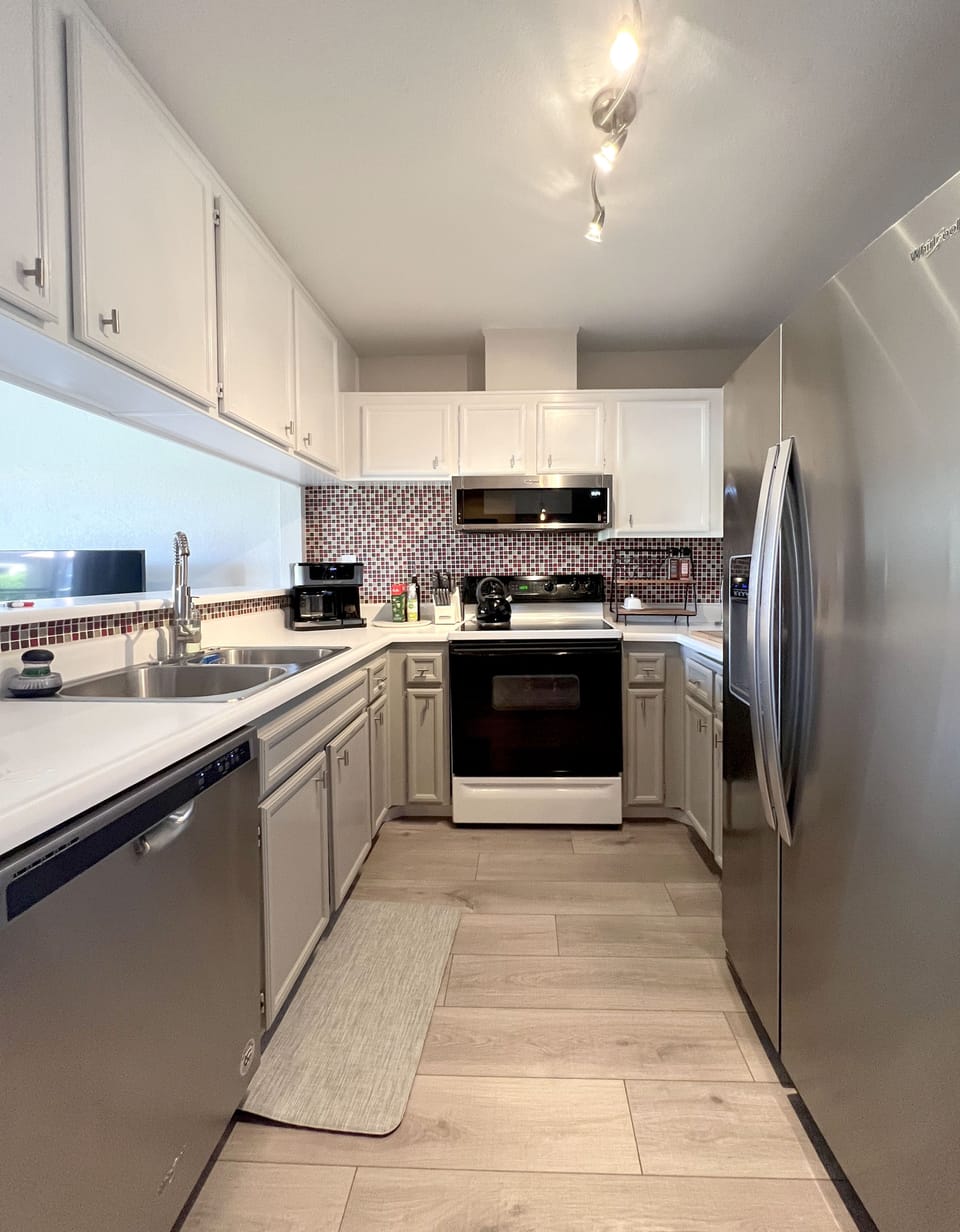 KITCHEN - fully stocked with pots, pans, dinnerware &  glasses. 