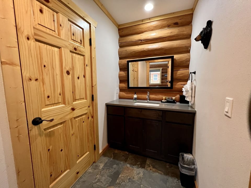 Vanity and sink separate from toilet/tub area