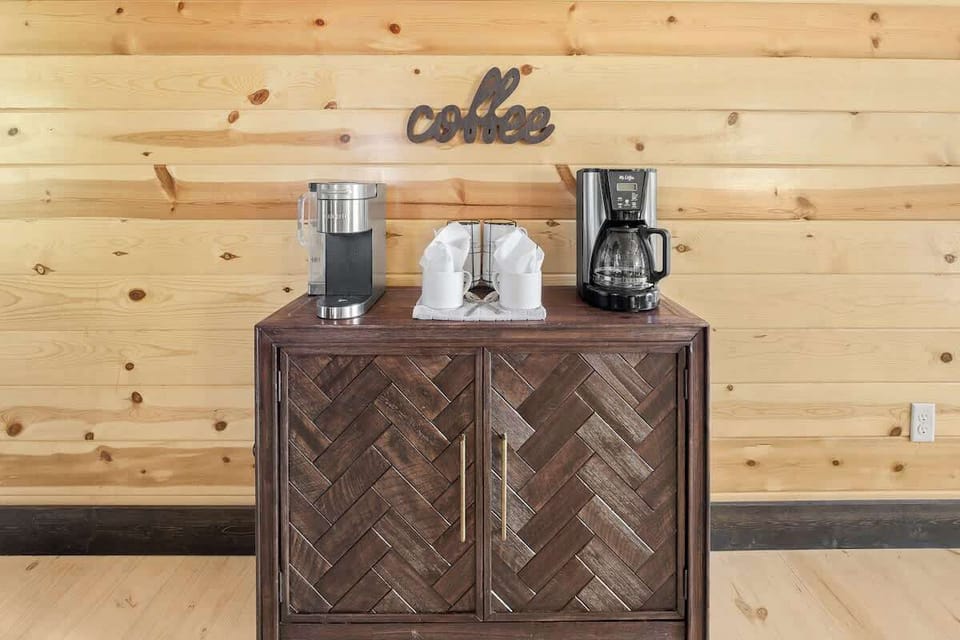 Coffee bar with Keurig and ground coffee maker.  Coffee pods, grounds, filters, Coffee Mate creamer, hot chocolate and tea provided.   