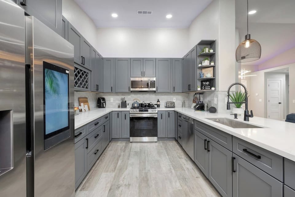 Custom Designed Kitchen with New Samsung Steel Appliances and a New Family Hub Touch Screen Samsung Fridge. 