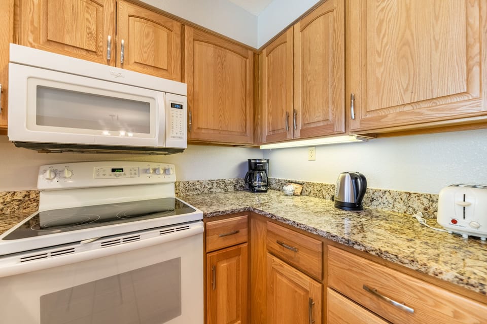 Your fully equipped kitchen features granite countertops, oak cabinets, and all the appliances you need for home cooking.