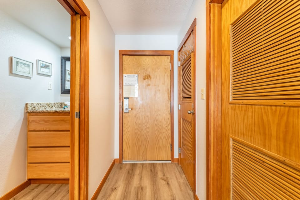 Step into your welcoming entryway with rich wood accents and thoughtful storage solutions that make you feel instantly at home.