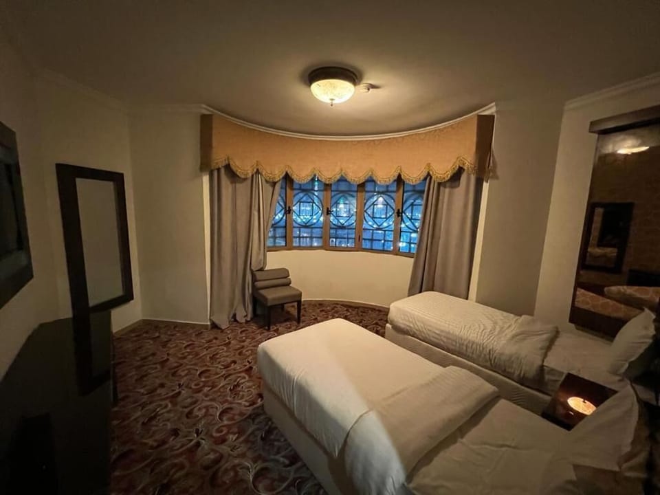 Minibar, desk, bed sheets