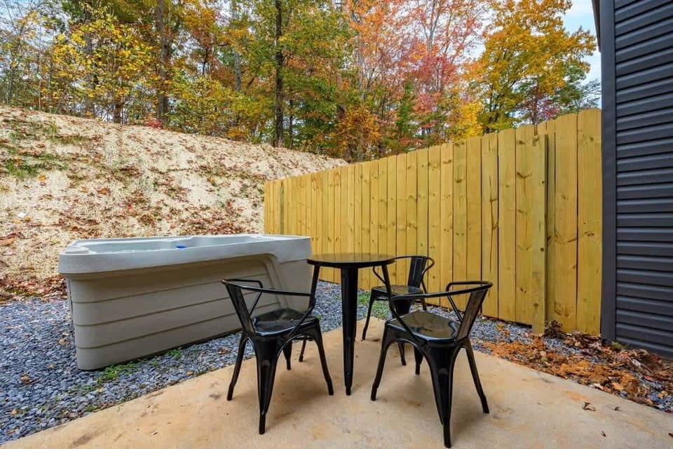Your Outdoor Hot Tub Retreat awaits! Unwind in style with bubbles and stunning fall views!