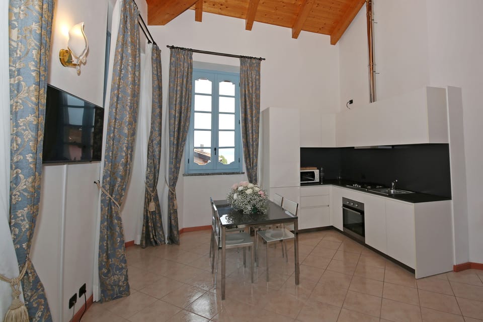 Apartment, 1 Bedroom, Lake View (La Torre) | Private kitchen | Espresso maker, electric kettle, highchair