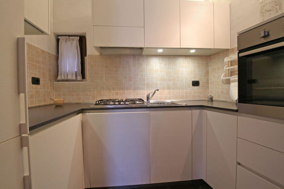 Apartment, 2 Bedrooms, Terrace, Lake View (Isola Comacina) | Private kitchen | Espresso maker, electric kettle, highchair