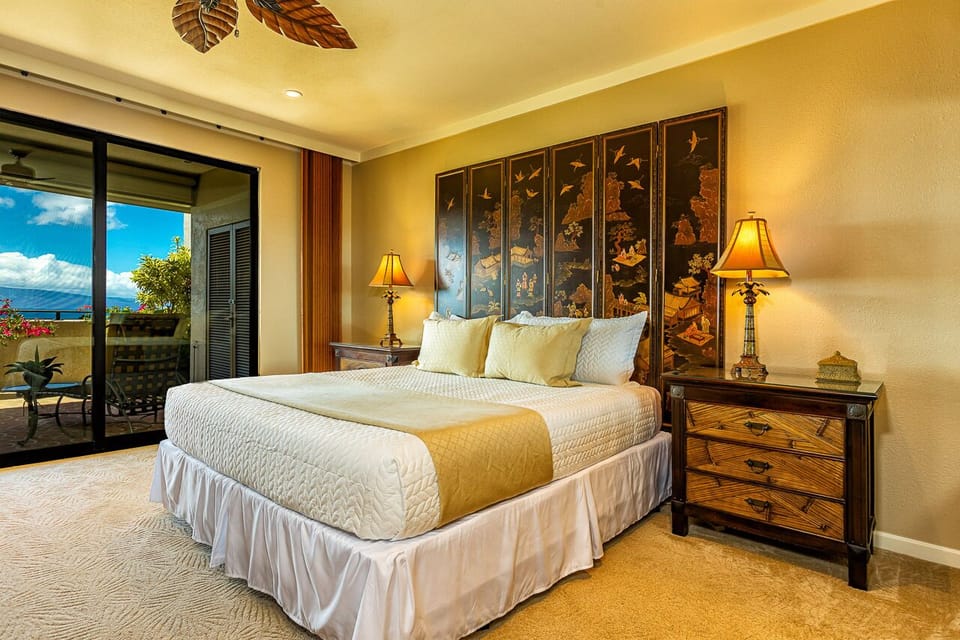 Slip into this serene bedroom where tropical-inspired décor and balcony access create your perfect island retreat. The plush king bed and ocean breezes invite you to unwind and recharge.