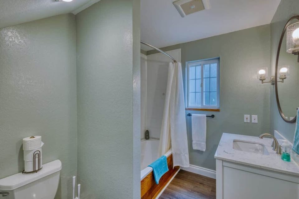 Discover luxury in our ensuite bathroom, offering modern fixtures and elegant design, providing a serene retreat for relaxation and rejuvenation.