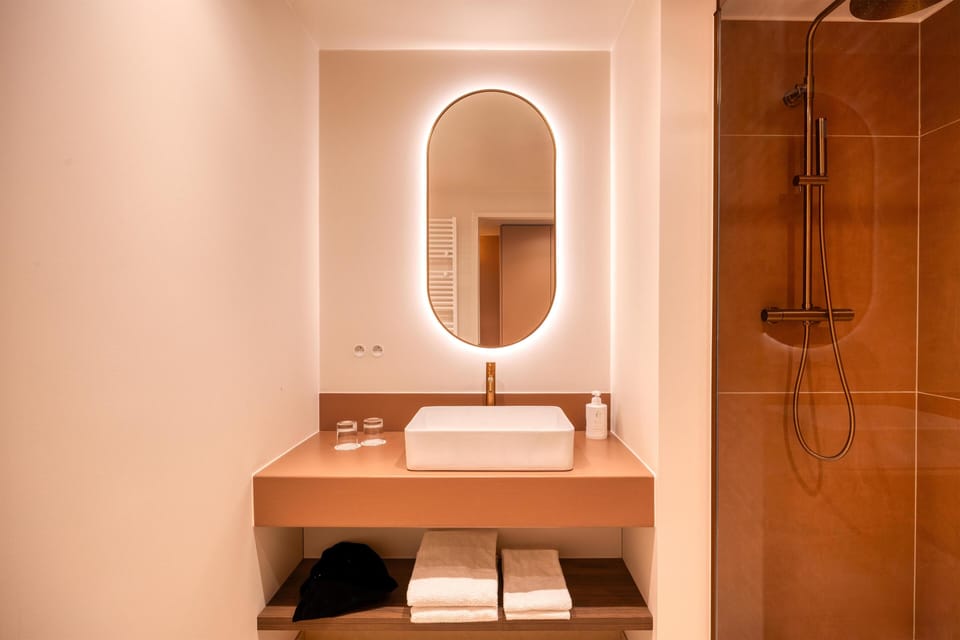 Shower, eco-friendly toiletries, hair dryer, towels
