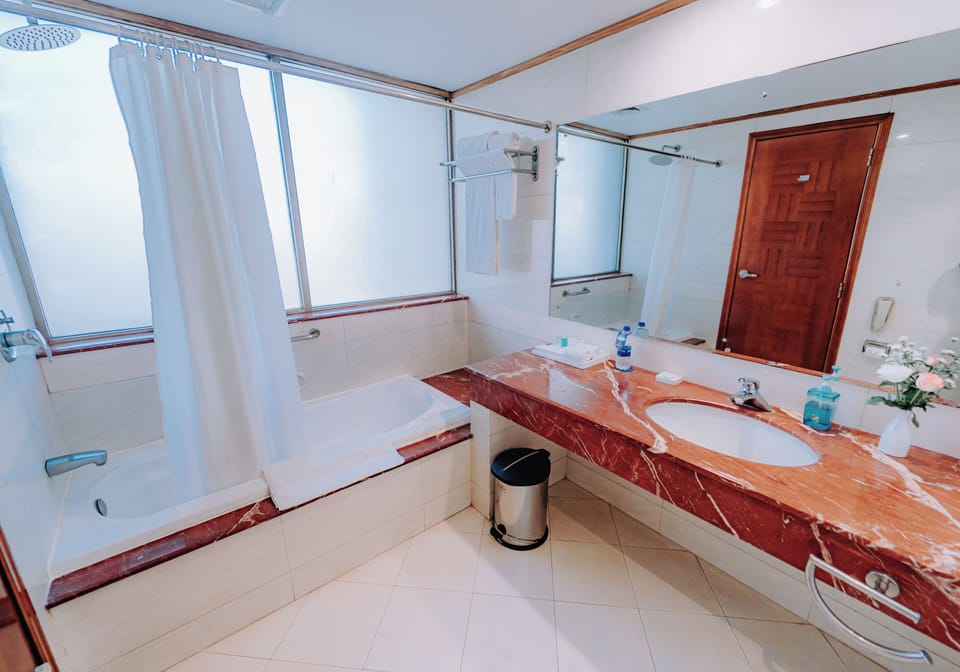 Exclusive Suite, 1 Bedroom | Bathroom | Combined shower/tub, rainfall showerhead, free toiletries, hair dryer