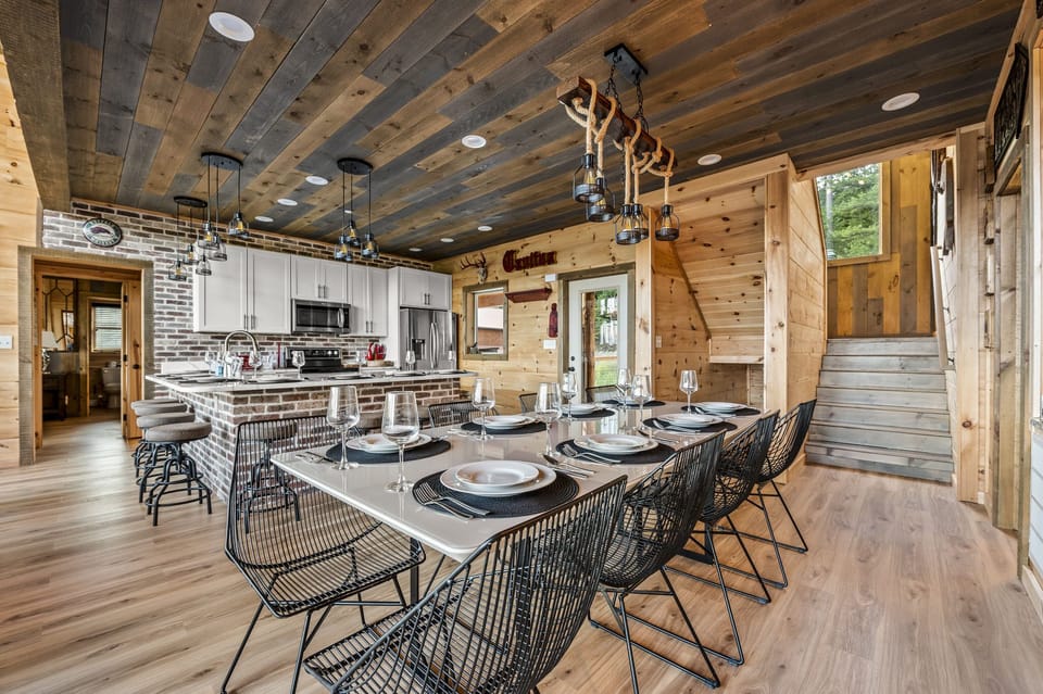 Seating for 16, 8 at kitchen island and 8 at dining table.