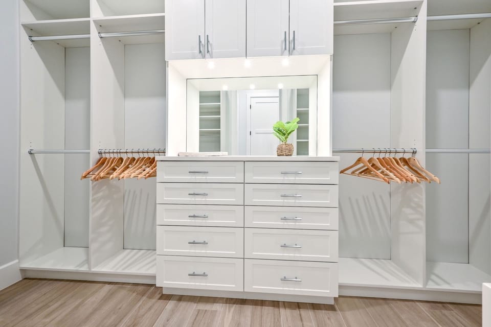 Custom Master closet with locked drawer for jewelry and other valuables.
