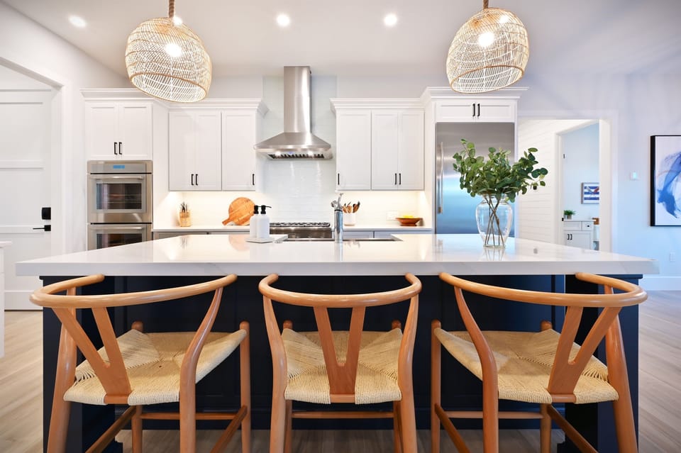 Coastal Kitchen open to the living room & dining room. Double oven, professional gas stove and a large fridge.