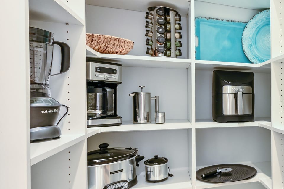 The pantry has all the small appliances and extras that you will need including an air frier, coffee pot, blender, and more!