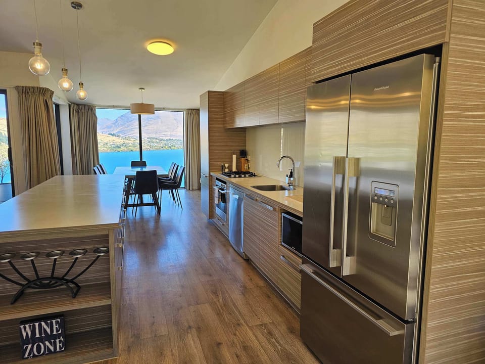 Spacious Kitchen with Upper Deck Access & back Patio Access