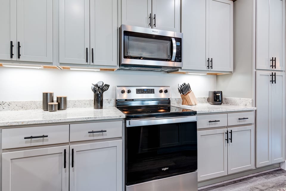 Fully stocked kitchen with modern appliances and all the tools to cook with ease