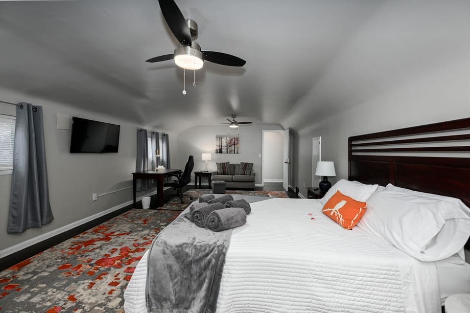Bedroom 3 - luggage rack, crib, fans, extra closet space, desk, chair, monitor