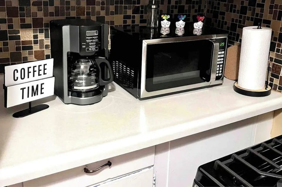 coffee maker + microwave in kitchen