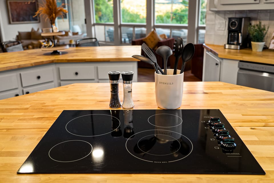 A beautifully designed kitchen with wooden countertops, modern appliances, and a cozy, inviting ambiance.