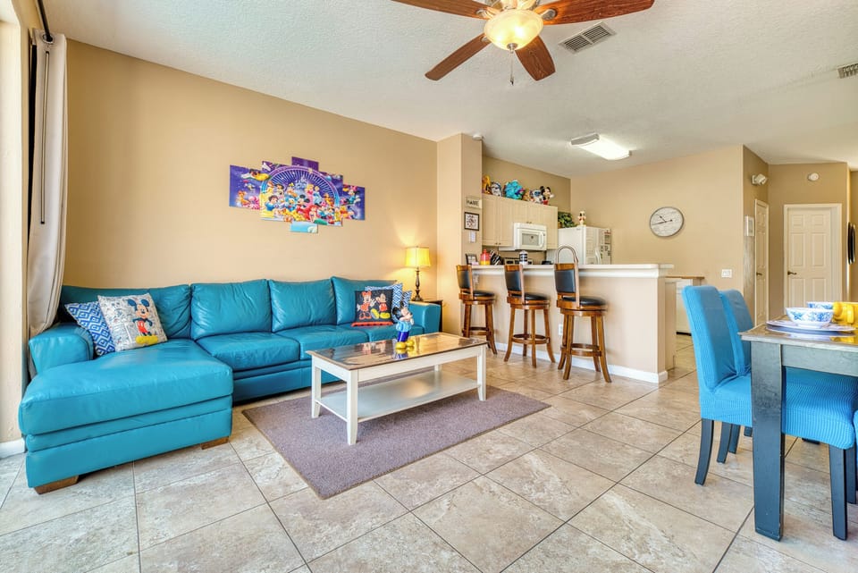 Lounge like Goofy after a long day at the parks in our vibrant living room. Colorful and cozy, it's the perfect spot for planning tomorrow's adventures or for a Disney movie marathon.