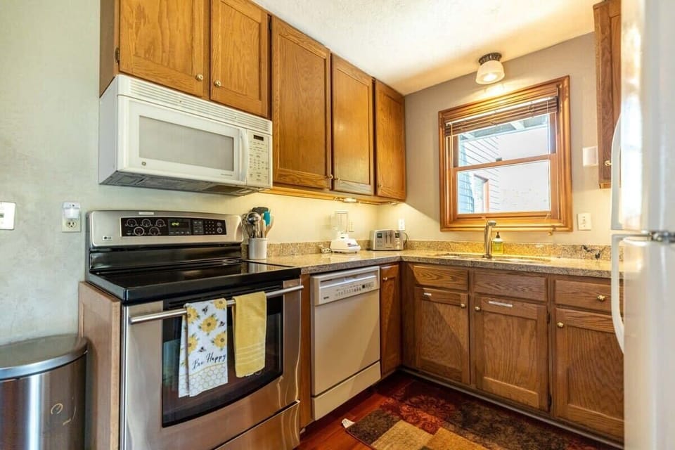 The kitchen comes complete with everything you may to prepare your meals in a cozy shared space with the dining room.