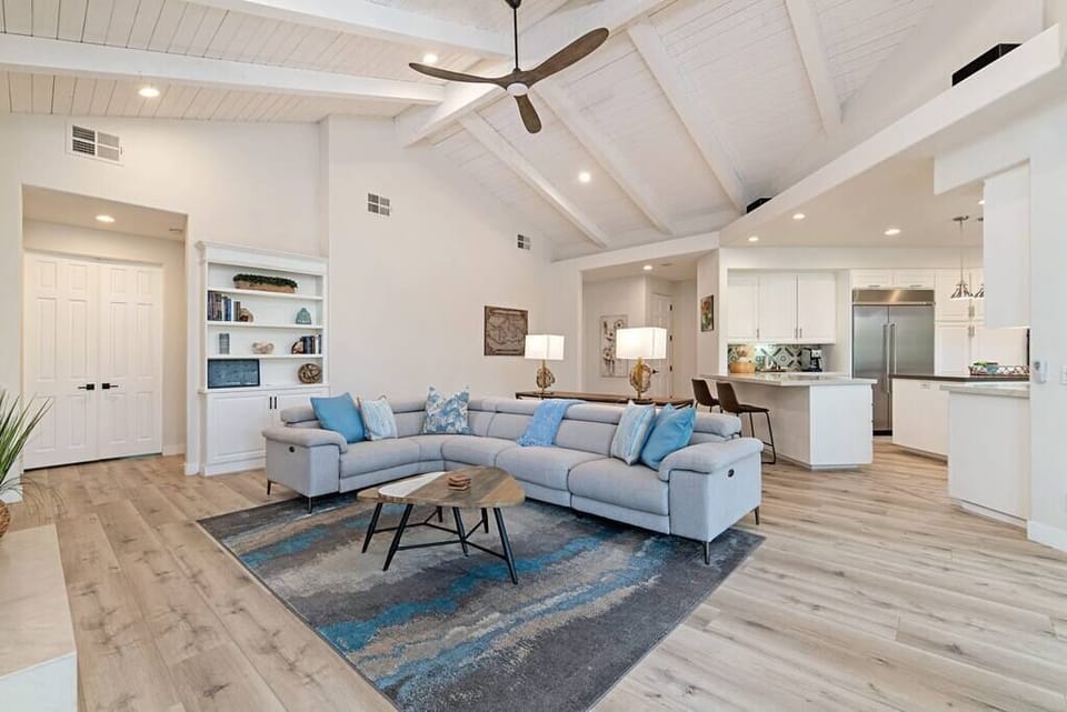 This open great room connected to the kitchen is the perfect and comfy spot for your family and friends