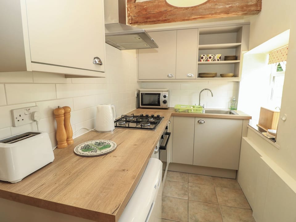 Fridge, electric kettle, toaster, cookware/dishes/utensils